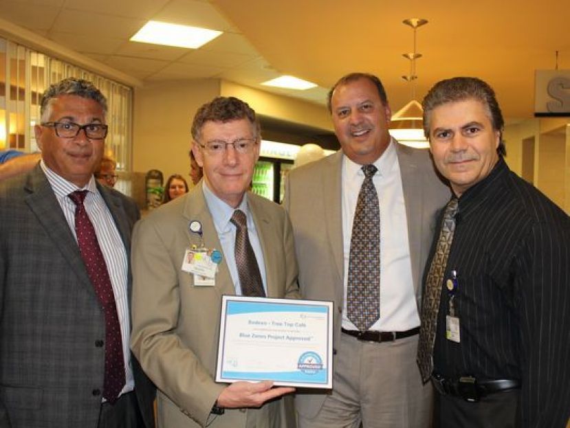 Bob Bucciarelli, vice president of Sodexo, from left; Dr. Allen Weiss, president and chief executive officer of the NCH Healthcare System; Carlos Noriega, regional director of Sodexo; and Lee Almeida, retail and catering manager for NCH.