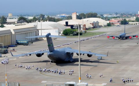 Airmen spread out around the flightline to begin a foreign-object-debris walk to remove trash and other objects from the area May 29, 2012, at Incirlik Air Base, Turkey. The FOD walk was a combined effort between the 39th Air Base Wing and Turkish air force 10th Tanker Base Command to clear the area of debris that could potentially damage aircraft engines.