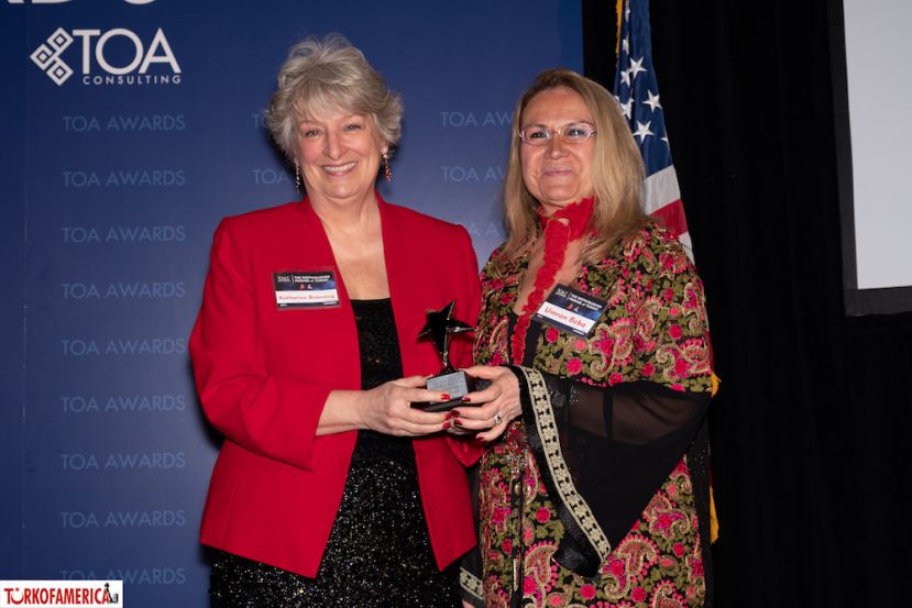 Katharine Branning receives her award from Umran Beba, Vice President of Pepsi Co. 