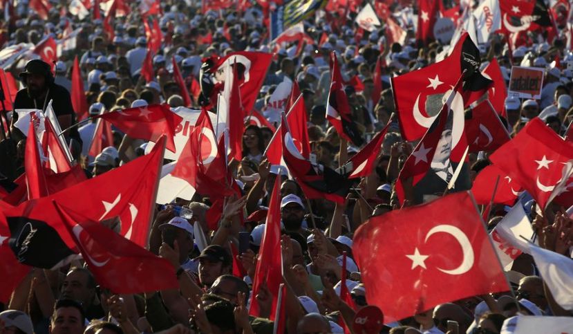 FILE - In this Sunday, July 9, 2017 file photo, supporters of Kemal Kilicdaroglu, the leader of Turkey&#039;s main opposition Republican People&#039;s Party, hold Turkish flags in Istanbul, as they gather for a rally following their 425-kilometer (265-mile) &#039;March for Justice&#039; from capital Ankara to Istanbul. Turkey declared a three-month state of emergency after a failed coup attempt in 2016, and has extended it seven times since then, but it is scheduled to end at midnight Wednesday July 18, 2018, though opposition leaders insists that new anti-terrorism laws are just as oppressive as the emergency powers they will replace. (AP Photo/Lefteris Pitarakis, File) 