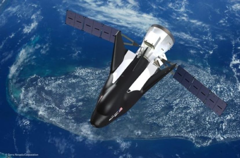 An artist’s conception shows Sierra Nevada Corp.’s robotic Dream Chaser space plane in orbit. (SNC Illustration)